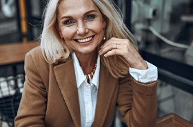 Smiling, mature professional woman with All-on-4 in Lebanon