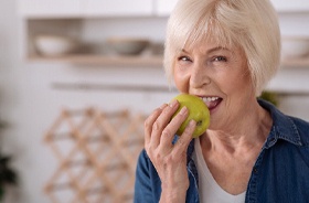 Senior woman enjoying many benefits of All-on-4 dental implants