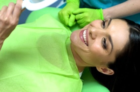 dental patient admires her smile
