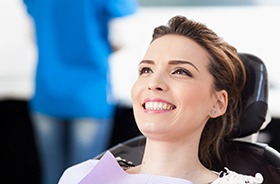 Smiling patient at appointment for preliminary dental implant care