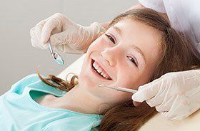 Child receiving dental exam