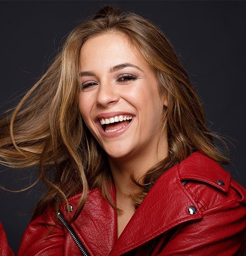 Grinning woman wearing red jacket