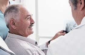 Smiling older man in dental chair