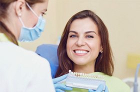 lady in chair with veneers chart