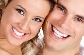 man and woman smiling cheek to cheek