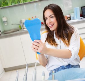 happy dental patient with mirror