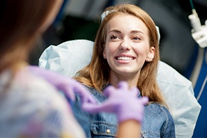 dental patient touching cheek