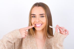 Smiling woman, trying to fix TMJ with Invisalign in Lebanon