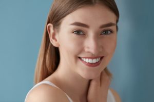 Woman with beautiful smile after using free teeth whitening kit