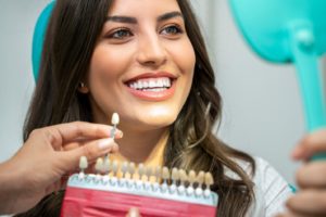 Woman with bright smile following teeth whitening after braces